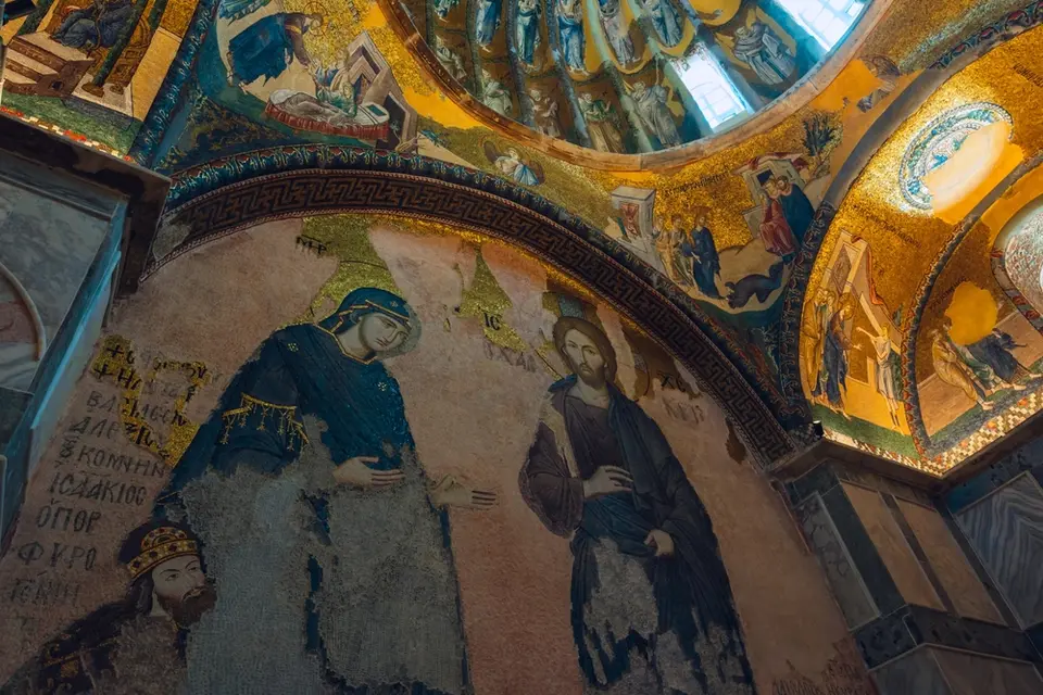 Large wall mosaic of Christ and the Virgin with a small crowned figure kneeling at the lower left, gold vault mosaics above